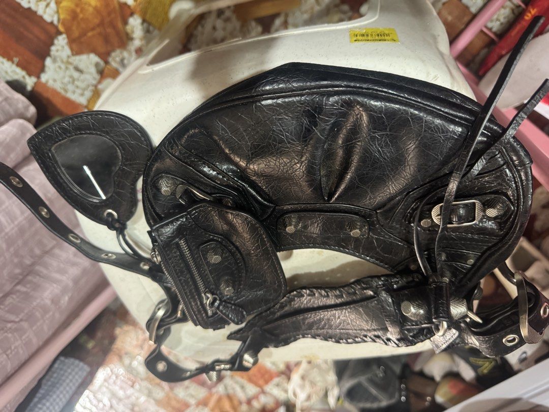 Balenciaga Paris Made Italy (Category: Luxury Bags & Wallets) located in Manila. Submitted by wildbear.e10374 (Listing ID 1460373456, Image 3). Description: Balenciaga Le Cagole Shoulder bag signature metal studs, an adjustable buckled strap, and an attached heart mirror or pouch 100% Made Italy bag. .
