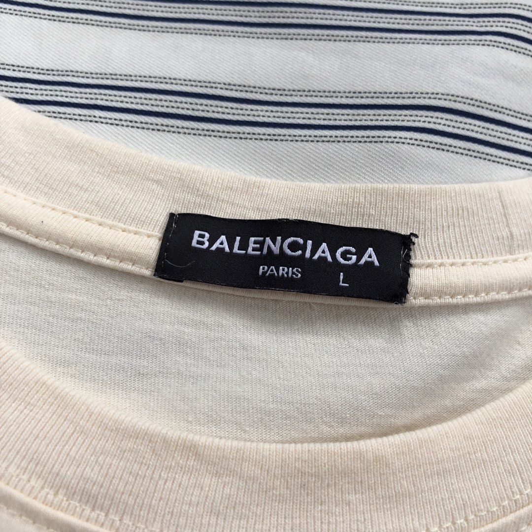 BALENCIAGA POLITICAL STENCIL (Category: Tshirts & Polo Shirts ) located in Dagupan City. Submitted by gabthriftfinds (Listing ID 1460484762, Image 3). Description: B*LENCIAGA POLITICAL STENCIL ₱450+sf🏷️ (FIRST TO PAY BASIS‼️) • No issue on print✅ • Dimension: Width: 22 | Lenght: 28 • Condition: excellent • Color rate: 9.5/10 • Flaws/Issue: rewash 📌 I am not affiliated with any brand mentioned. The registered trademark solely belongs to the righ