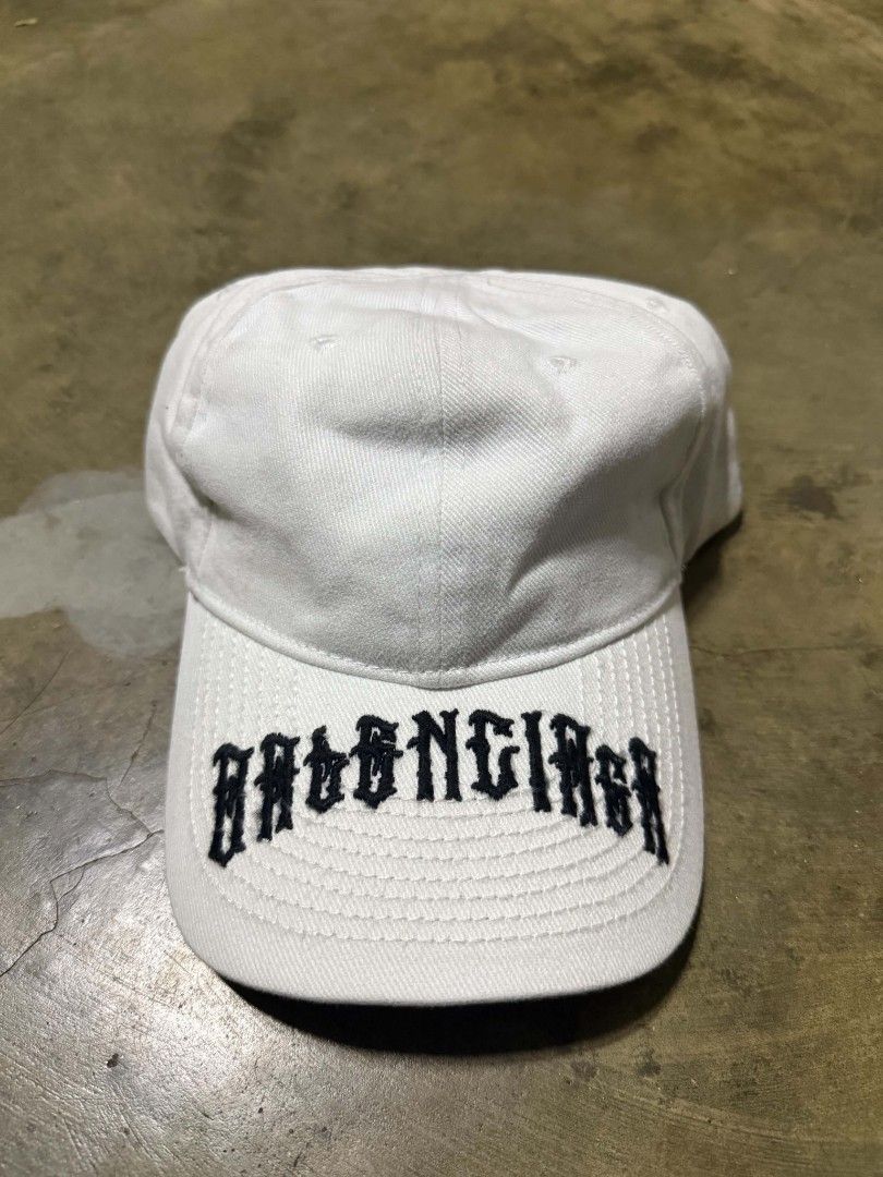 Balenciaga White Embroidered Logo Cap (Category: Caps & Hats) located in Manila. Submitted by thriftyboyzzz (Listing ID 1460468047, Image 1). Description: - Authentic White Balenciaga Cap - Features embroidered logo on the front - Made in Italy - 100% Cotton - Adjustable strap at the back - Ideal for everyday wear - Please check photos for detailed condition.