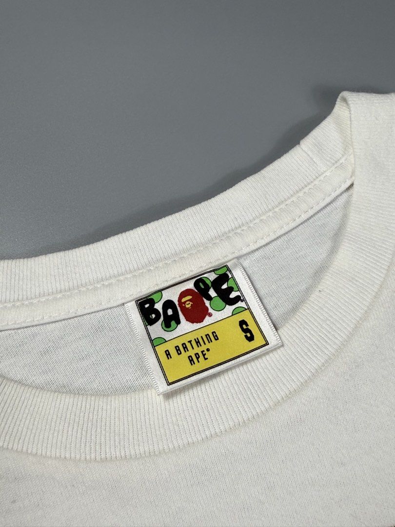 Bape Busy Works Gold Circle Logo Tee White (Category: Tshirts & Polo Shirts ) located in Manila. Submitted by whowearsstreetwear (Listing ID 1460482941, Image 3). Description: Bape Busy Works Gold Circle Logo Tee White (Authentic) - Size: Small on tag (measurements in inches) W - 19 L - 25 Condition: Excellent Flaw/s: minor stain only + shipping fee Location: Manila (Near UST).