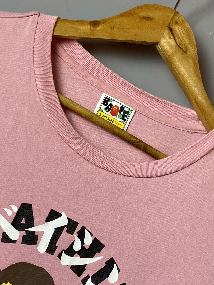Bape Katakana College Tees (Category: Tshirts & Polo Shirts ) located in Quezon City. Submitted by loloyz123 (Listing ID 1460450709, Image 3). Description: Bape Katakana College Tees- Womens Condition: Very good Color rate: 10/10 Color: Pink Size: Small L: 25 W: 18 inches.