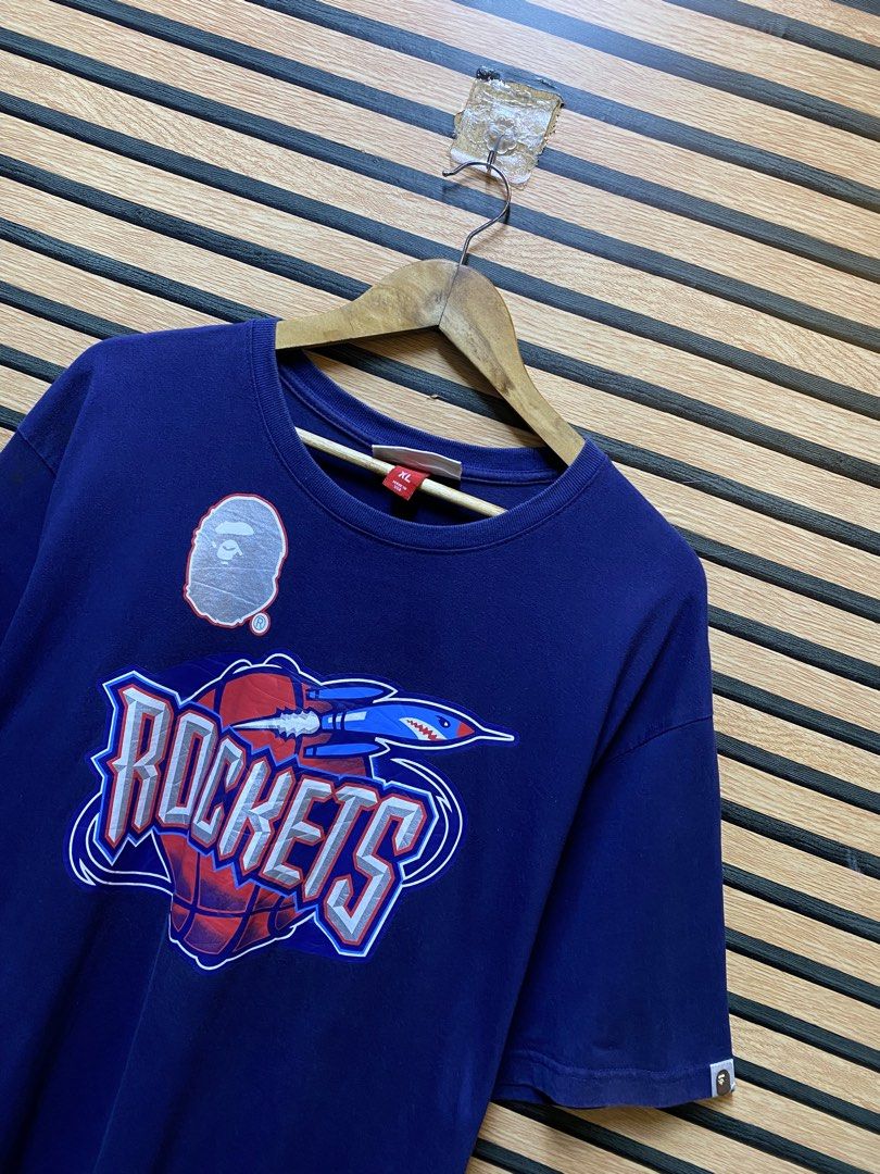BAPE x MITCHELL & NESS “HOUSTON ROCKETS” (Category: Tshirts & Polo Shirts ) located in Makati City. Submitted by drip.poww (Listing ID 1460460903, Image 3). Description: - Authentic Bape x Mitchell & Ness - Color: Navy Blue - Size: XL - Dimes: 24x30 - Authentic - Excellent condition - Need wash, fresh from bale - Material: 100% Cotton Please don’t expect too much—these are thrifted (ukay) items. 😊 !!STILL NEGOTIABLE!!.