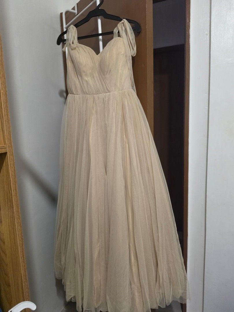 Beige long gown / bridesmaid (Category: Evening dresses & gowns) located in Cavite. Submitted by jmccm (Listing ID 1460448887, Image 1). Description: custom design beige long gown padded small-medium frames adjustable straps.