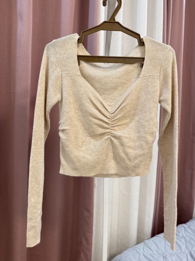 Beige Ruched V-Neck Long Sleeve Cropped Top (Category: Longsleeves) located in Butuan. Submitted by notcwp (Listing ID 1460333717, Image 1). Description: - Cute beige long sleeve top - Flattering ruched detail at the front - V-neckline - Soft and stretchy material - Versatile: pairs well with jeans or skirts - Ideal for casual outings or nights with friends - Easy to style and comfortable to wear.