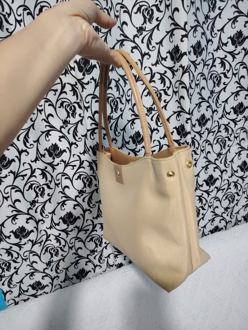 Beige Shoulder Bag with Tan Straps (Category: Shoulder Bags) located in Manila. Submitted by theshopandsmile (Listing ID 1460444023, Image 1). Description: - Classic beige shoulder bag - Tan leather straps - Simple and chic design - Gold hardware details - Perfect for everyday use - Ample interior space - Versatile accessory for any outfit - Easy to carry.