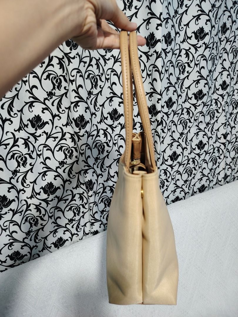 Beige Shoulder Bag with Tan Straps (Category: Shoulder Bags) located in Manila. Submitted by theshopandsmile (Listing ID 1460444023, Image 3). Description: - Classic beige shoulder bag - Tan leather straps - Simple and chic design - Gold hardware details - Perfect for everyday use - Ample interior space - Versatile accessory for any outfit - Easy to carry.