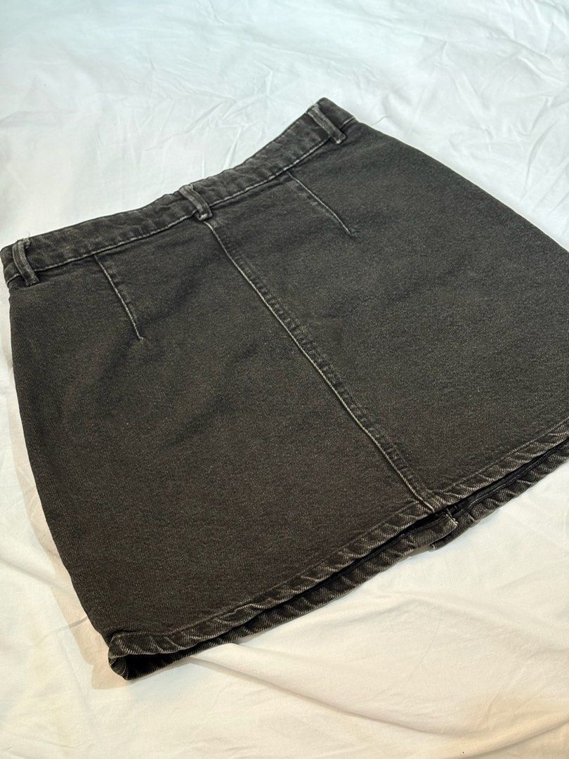 Bershka Black Button-Front Denim Mini Skirt (Category: Skirts) located in Pasay City. Submitted by nicoletlntn_ (Listing ID 1460429476, Image 2). Description: Bershka black denim mini skirt. Button front, 5 pockets. Versatile for any outfit. Waist 27-28.
