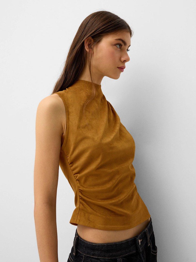 BERSHKA Brown Suede Sleeveless Top (Category: Sleeveless) located in Cebu City. Submitted by zarizariii___ (Listing ID 1460322478, Image 1). Description: Used twice!! Got this for ₱2k.