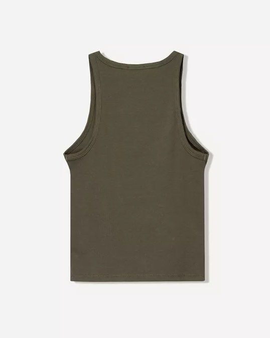 BERSHKA Sleeveless Ribbed Top (Category: Sleeveless) located in Cebu City. Submitted by zarizariii___ (Listing ID 1460454151, Image 2). Description: - Olive green ribbed tank top - Racerback style with a scoop neck - Stretchy and comfortable material - Essential wardrobe staple✨.
