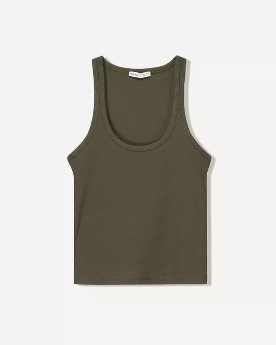 BERSHKA Sleeveless Ribbed Top (Category: Sleeveless) located in Cebu City. Submitted by zarizariii___ (Listing ID 1460454151, Image 1). Description: - Olive green ribbed tank top - Racerback style with a scoop neck - Stretchy and comfortable material - Essential wardrobe staple✨.