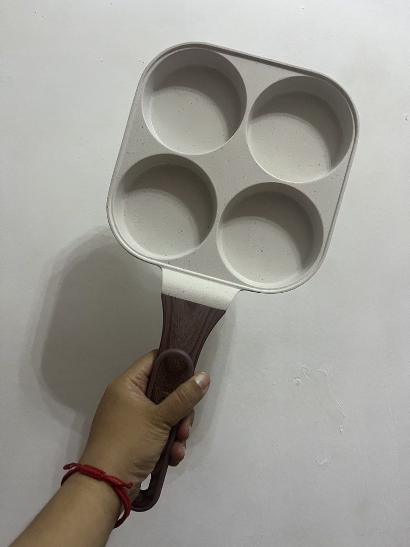 BESCO 4-Hole Egg Non-Stick Frying Pan (Category: Cookware & Accessories) located in Dasmarinas. Submitted by purpleboxmidori (Listing ID 1460471695, Image 1). Description: - BESGO 4-hole frying pan - Non-stick surface - Comfortable wood-like handle - Ideal for cooking pancakes, eggs, and more - Easy to clean - Great for quick breakfasts - Selling as it's rarely used.