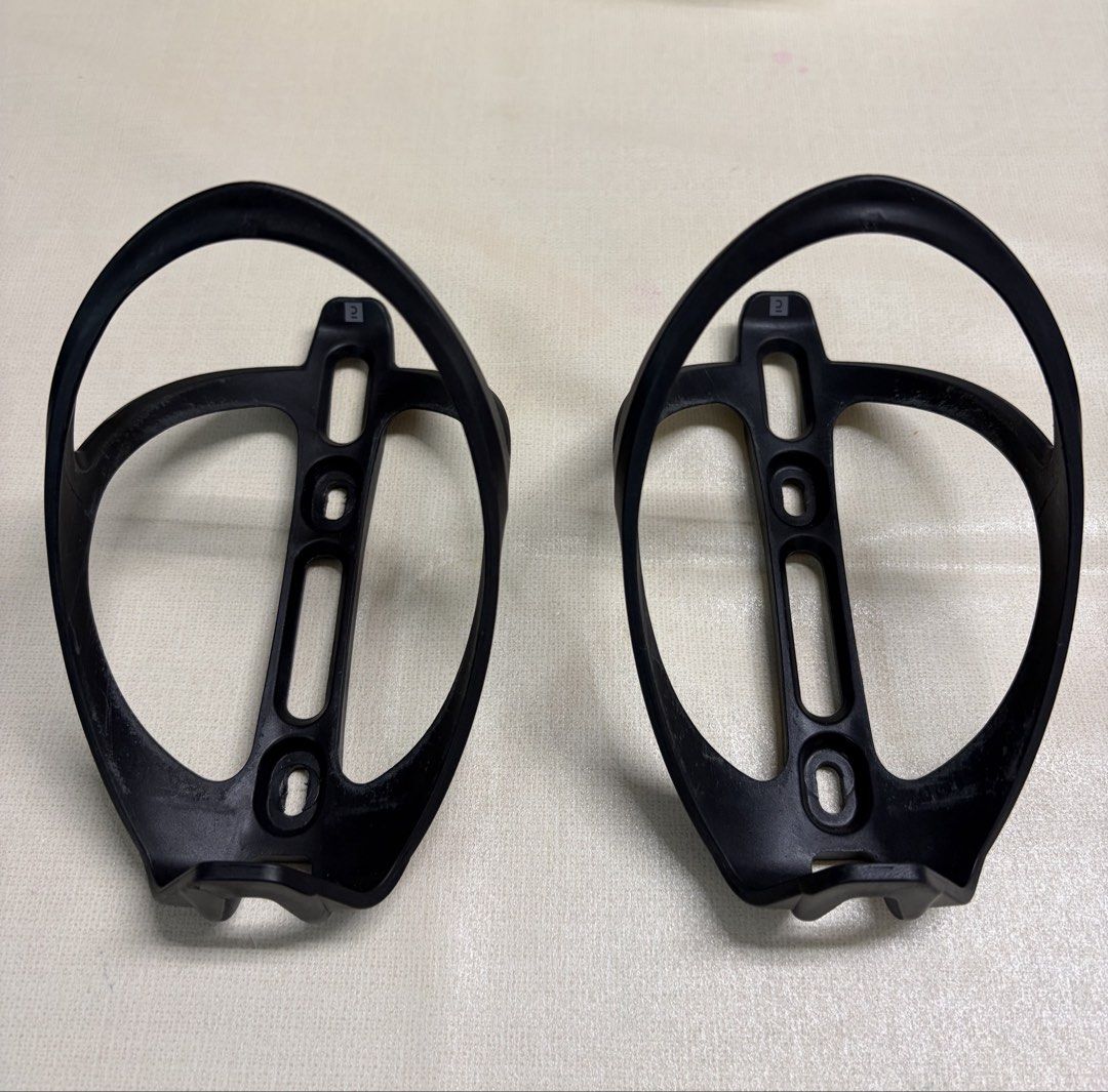 Bike Bottle Holder/Cage (Category: Bicycles) located in Quezon City. Submitted by ivd01 (Listing ID 1459292881, Image 2). Description: - Lightweight plastic water bottle cage - Standard size, fits most bike frames - Color: Black - Minor scuffs from normal use, still very sturdy and functional - Ready to mount on your bike • 2pcs available on hand• .