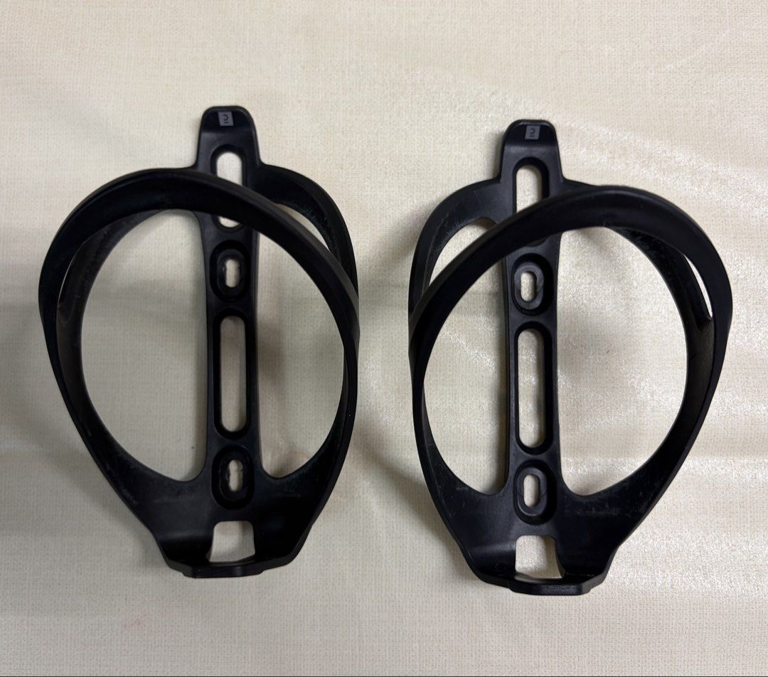 Bike Bottle Holder/Cage (Category: Bicycles) located in Quezon City. Submitted by ivd01 (Listing ID 1459292881, Image 1). Description: - Lightweight plastic water bottle cage - Standard size, fits most bike frames - Color: Black - Minor scuffs from normal use, still very sturdy and functional - Ready to mount on your bike • 2pcs available on hand• .