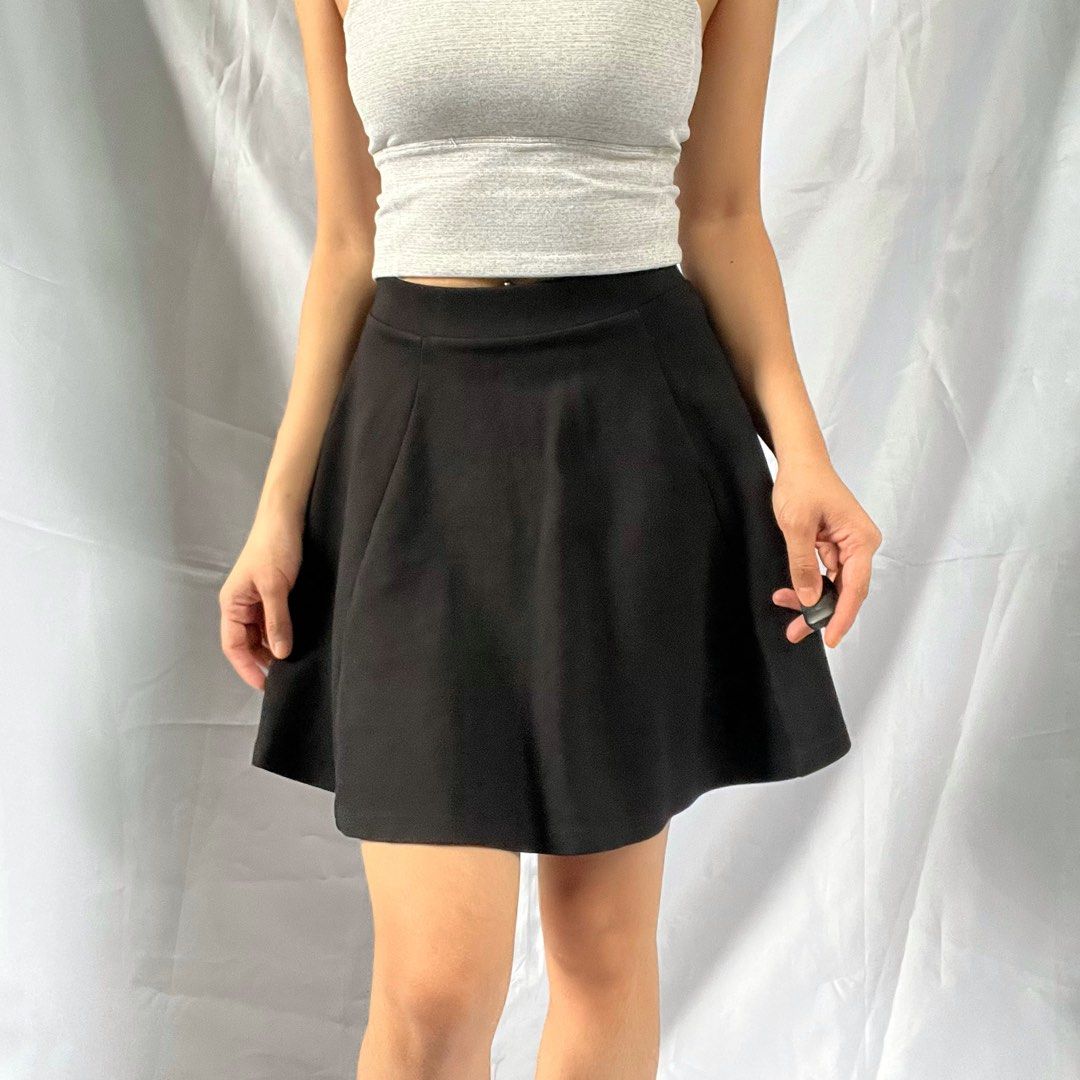 Black A-Line Skater Skirt (Category: Skirts) located in Manila. Submitted by demi.rewears (Listing ID 1460313636, Image 3). Description: Classic black skater skirt. High-waisted, A-line cut. Comfortable and versatile for any occasion. Tag Size: XS Waist: 10” (Flat) / Fits 21-25” Waist (Stretchable) Length: 15” Rise: High-Rise Style: A-Line / Skater Skirt Color: Solid Black Condition: Excellent curated condition with no visible flaws..
