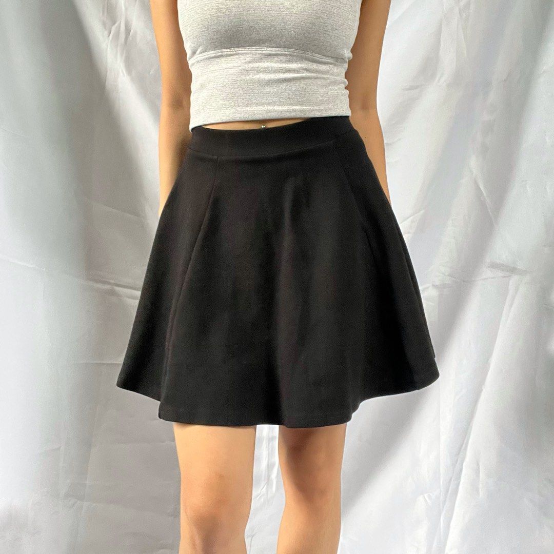 Black A-Line Skater Skirt (Category: Skirts) located in Manila. Submitted by demi.rewears (Listing ID 1460313636, Image 2). Description: Classic black skater skirt. High-waisted, A-line cut. Comfortable and versatile for any occasion. Tag Size: XS Waist: 10” (Flat) / Fits 21-25” Waist (Stretchable) Length: 15” Rise: High-Rise Style: A-Line / Skater Skirt Color: Solid Black Condition: Excellent curated condition with no visible flaws..