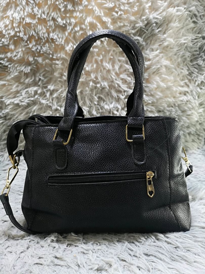 Black Faux Leather Top Handle Bag (Category: Purses & Pouches) located in Santa Cruz. Submitted by jmy_surplus.2 (Listing ID 1460452713, Image 3). Description: Size ; L - 8 W - 10 Color ; Black Type ; Hand bag Brand ; No Brand Material ; Leather Style ; Black leather Hand bag LR 169 JMY 5 Batch #218.