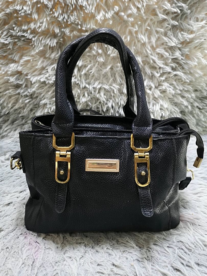Black Faux Leather Top Handle Bag (Category: Purses & Pouches) located in Santa Cruz. Submitted by jmy_surplus.2 (Listing ID 1460452713, Image 1). Description: Size ; L - 8 W - 10 Color ; Black Type ; Hand bag Brand ; No Brand Material ; Leather Style ; Black leather Hand bag LR 169 JMY 5 Batch #218.