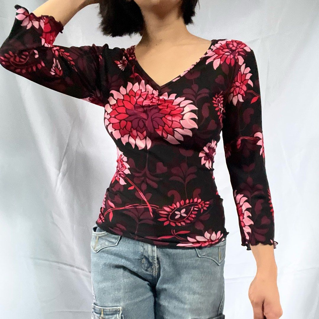 Black Floral Mesh Long Sleeve Top (Category: Longsleeves) located in Manila. Submitted by demi.rewears (Listing ID 1460314961, Image 2). Description: Cute sheer black mesh top with pink/red floral print. Features ruched bust and lettuce hem sleeves. Stretchy fabric. Versatile for night out or casual wear. Bust: 16” (Flat) / Fits up to 32” Bust Length: 22.5” Sleeve Style: 3/4 Sleeves with Lettuce Trim Neckline: Ruched V-Neck Pattern: Bold Floral /