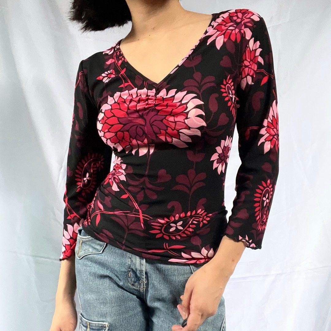 Black Floral Mesh Long Sleeve Top (Category: Longsleeves) located in Manila. Submitted by demi.rewears (Listing ID 1460314961, Image 1). Description: Cute sheer black mesh top with pink/red floral print. Features ruched bust and lettuce hem sleeves. Stretchy fabric. Versatile for night out or casual wear. Bust: 16” (Flat) / Fits up to 32” Bust Length: 22.5” Sleeve Style: 3/4 Sleeves with Lettuce Trim Neckline: Ruched V-Neck Pattern: Bold Floral /
