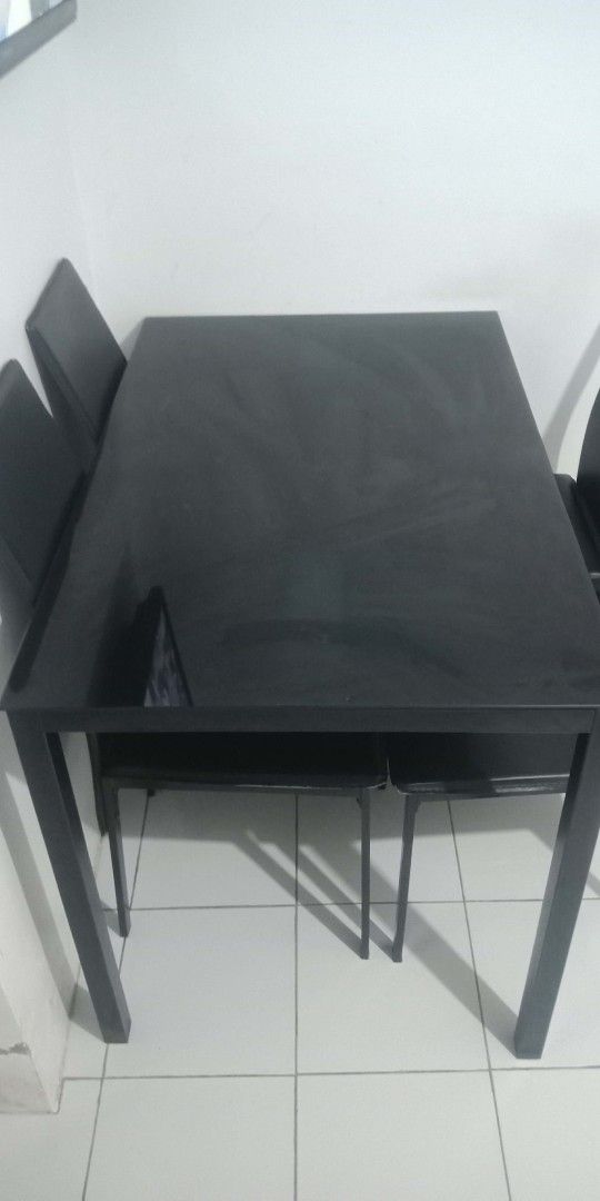 Black Glass Top Dining Table with 4 Chairs (Category: Tables & Sets) located in Manila. Submitted by rayannange07114 (Listing ID 1460330315, Image 1). Description: CAVITE AREA - Sleek black glass top dining table - Includes 4 matching black chairs - Modern and stylish design - Comfortable seating for 4 people - Ideal for small dining areas or kitchens - Easy to clean glass surface - Sold as a complete set May issue lang isa upuan medyo nagewang n