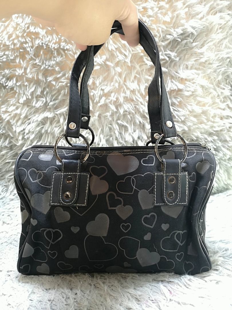Black Heart Design Mini Hand Bag (Category: Purses & Pouches) located in Santa Cruz. Submitted by jmy_surplus.2 (Listing ID 1460455632, Image 2). Description: Size ; L - 8 W - 10.4 Color ; Black Type ; Hand bag Brand ; No brand Material ; Synthetic Style ; Black Mini Boston hand bag LR 173 JMY 5 Batch #218.