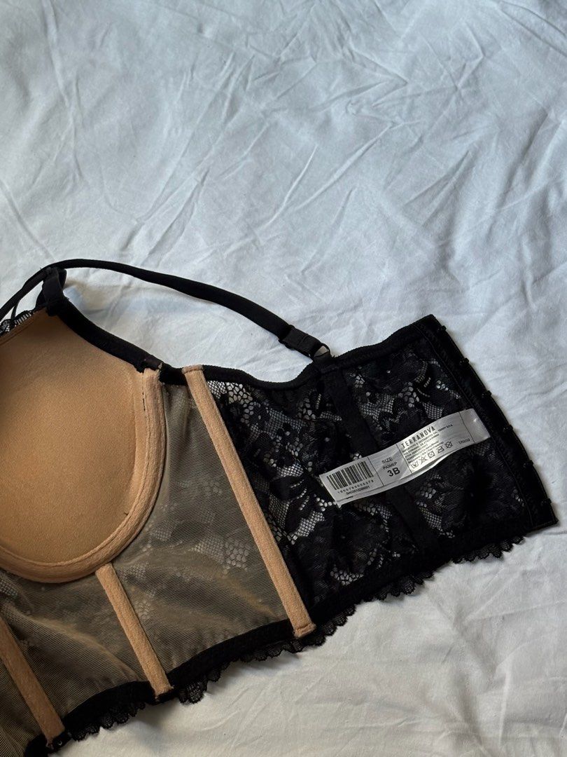 Black Lace Corset Bra with Straps - Size 36B (Category: Undergarments & Loungewear) located in Pasay City. Submitted by nicoletlntn_ (Listing ID 1460480604, Image 2). Description: - Black lace corset bra - Nude lining for contrast - Adjustable straps - Underwire for support - Lace trim along bottom hem - Perfect for layering or wearing alone.
