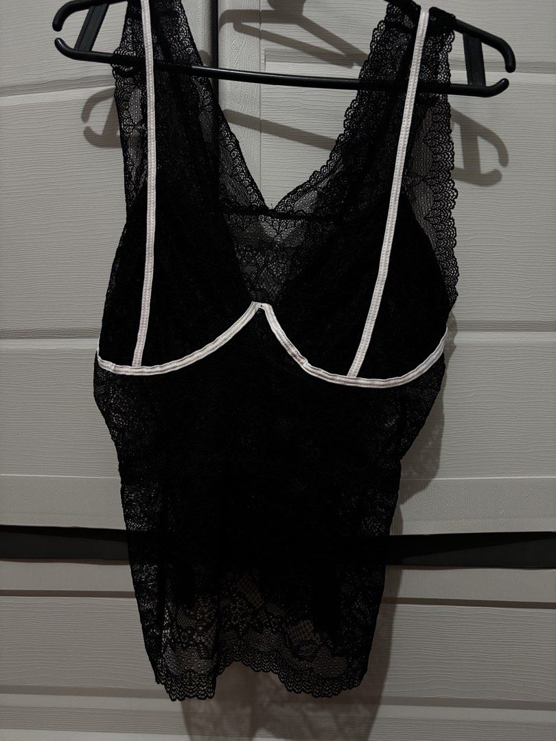 black lace top (Category: Sleeveless) located in Manila. Submitted by jojimiller_10 (Listing ID 1460341797, Image 1). Description: FORR FREEEE !!.