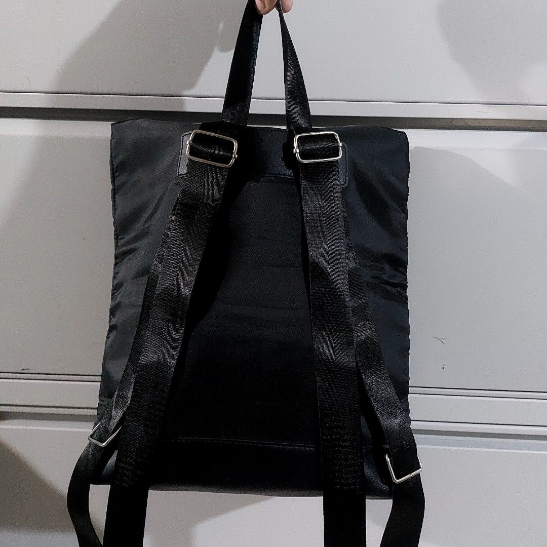 Black Nylon Backpack with Adjustable Straps (Category: Backpacks) located in Caloocan City. Submitted by lewy_ernitas (Listing ID 1460332781, Image 3). Description: -Bought in Thailand - Durable black nylon backpack - Two adjustable shoulder straps for comfortable carrying - Two top handles for alternative carrying options - Secure main compartment with zipper closure - Convenient front zip pocket for quick access to essentials - Simple, function
