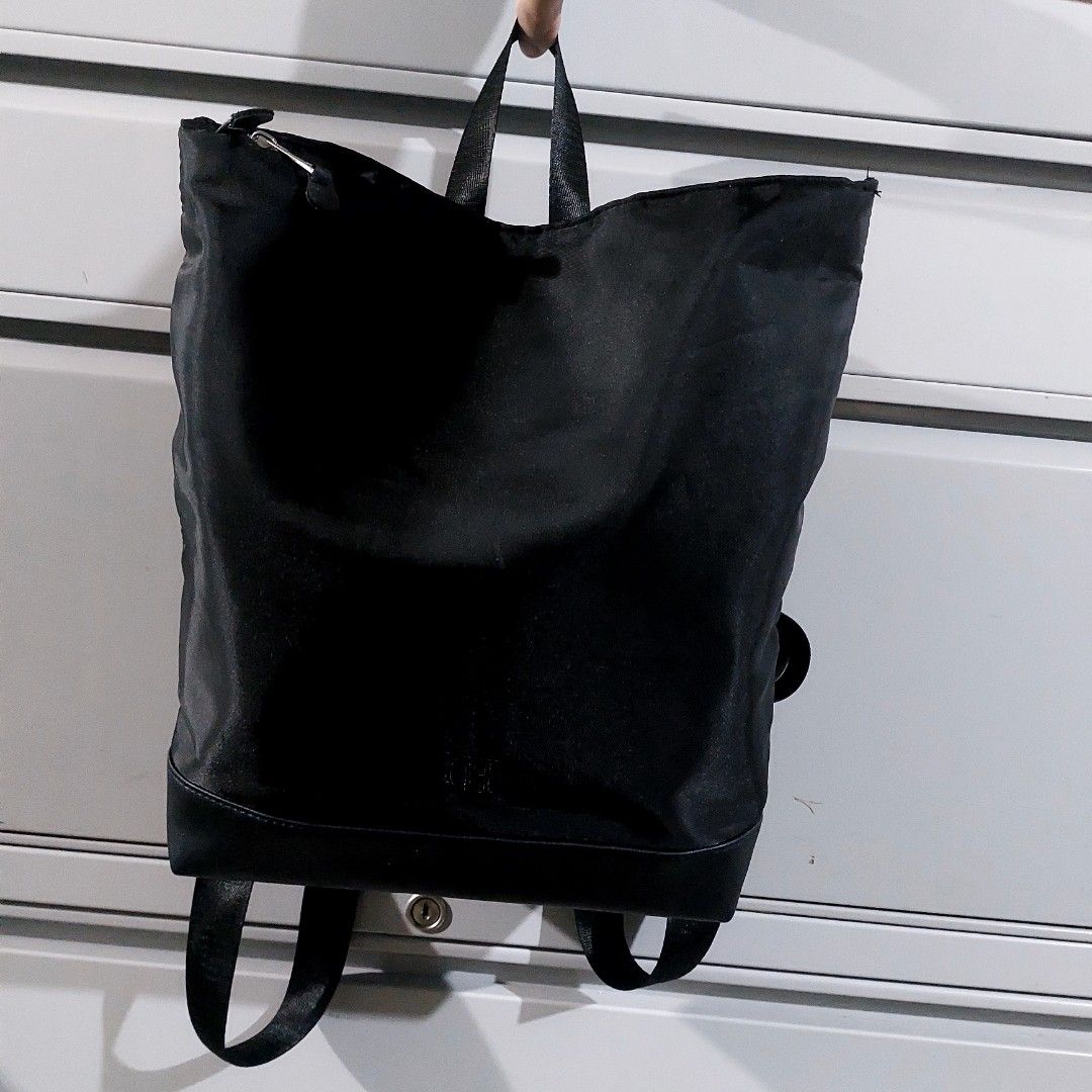 Black Nylon Backpack with Adjustable Straps (Category: Backpacks) located in Caloocan City. Submitted by lewy_ernitas (Listing ID 1460332781, Image 1). Description: -Bought in Thailand - Durable black nylon backpack - Two adjustable shoulder straps for comfortable carrying - Two top handles for alternative carrying options - Secure main compartment with zipper closure - Convenient front zip pocket for quick access to essentials - Simple, function