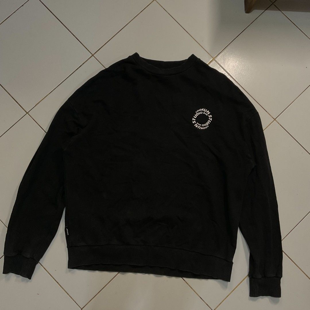 Black Sweatshirt with Rhinestone Logo (Category: Longsleeves) located in Morong. Submitted by rusty.vault (Listing ID 1460416136, Image 3). Description: - Black long-sleeved sweatshirt - Features a circular graphic on the back with sparkling rhinestones - Small graphic detail on the front left chest - Classic crew neck design - Ribbed cuffs and hem for a comfortable fit - Estimated size L/XL (please refer to measurements for accuracy) - Ideal for