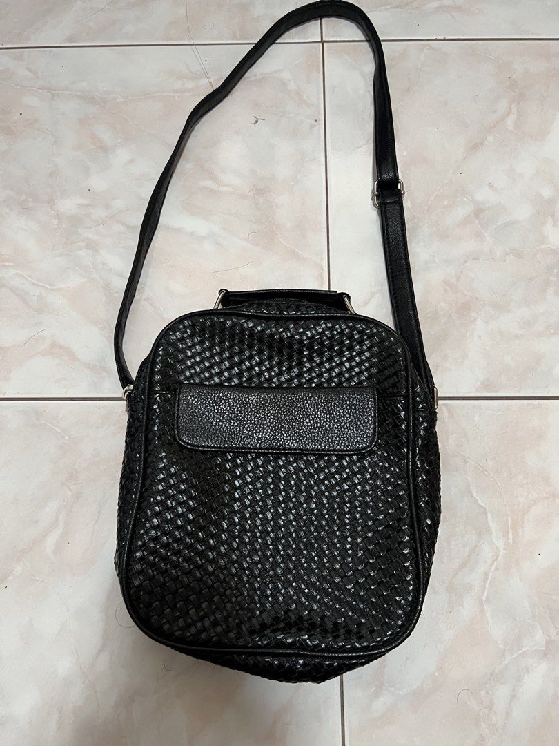 Black woven crossbody bag (Category: Cross-body Bags) located in Manila. Submitted by rlab_japan_thrift (Listing ID 1460393433, Image 1). Description: Black Woven Crossbody & Shoulder Bag Sleek black sling bag featuring a classic woven texture, front flap slip pocket, top handle, and adjustable shoulder strap. Zippered main compartment keeps essentials secure and organized for daily use. * Style: Woven Crossbody / Shoulder Bag * Width: Approx. 8.