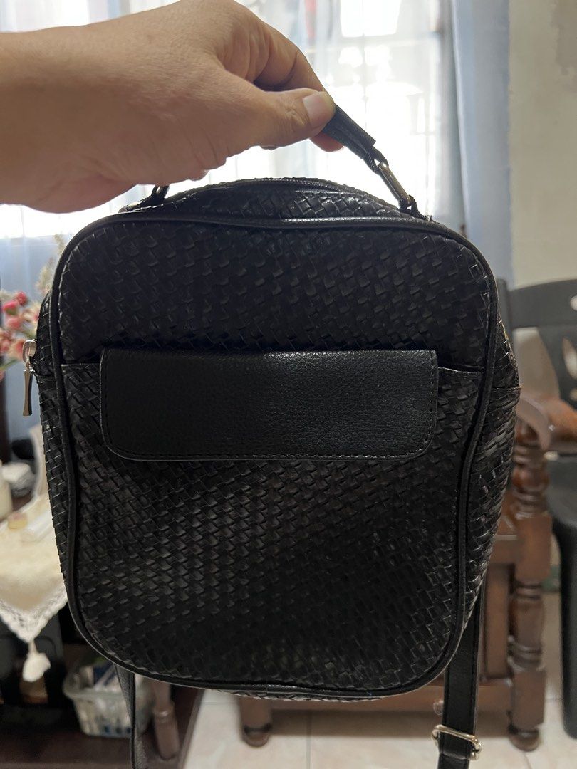 Black woven crossbody bag (Category: Cross-body Bags) located in Manila. Submitted by rlab_japan_thrift (Listing ID 1460393433, Image 3). Description: Black Woven Crossbody & Shoulder Bag Sleek black sling bag featuring a classic woven texture, front flap slip pocket, top handle, and adjustable shoulder strap. Zippered main compartment keeps essentials secure and organized for daily use. * Style: Woven Crossbody / Shoulder Bag * Width: Approx. 8.