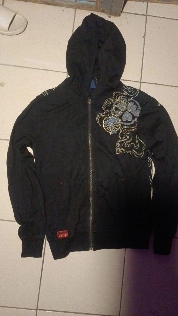 Black Zip-Up Hoodie with Eagle Embroidery (Category: Coats, Jackets and Outerwear) located in Kapatagan. Submitted by corsethrift (Listing ID 1460434448, Image 2). Description: - Black zip-up hoodie - Detailed eagle embroidery on back with gold accents - Embroidery on front left chest - Long sleeves with ribbed cuffs - Full zip closure - Ideal for casual wear.