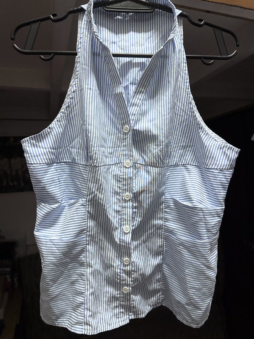 blue & white striped halter neck button-up (Category: Blouses) located in Manila. Submitted by samllian (Listing ID 1460442062, Image 1). Description: - Adorable blue and white striped halter neck top. - Features a flattering V-neckline with a button-up front. - Sleeveless design for a cool and comfortable fit. - Two stylish pocket details on the front. - Versatile piece for casual outings or dressing up..