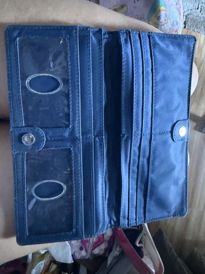Blue Bifold Wallet with ID Window (Category: Luxury Bags & Wallets) located in Taguig. Submitted by ayieabolencia (Listing ID 1460459645, Image 1). Description: - Stylish blue bifold wallet - Two clear ID windows for easy access - Multiple card slots for organization - Secure snap closure - Generous space for cash and cards - Ideal for everyday carry.