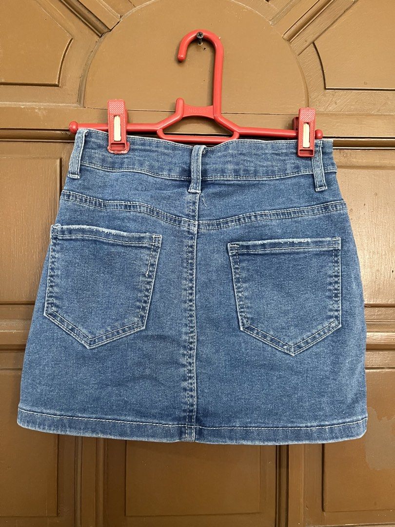 Blue Denim A-Line Mini Skirt (Category: Skirts) located in Manila. Submitted by ellesmr122 (Listing ID 1460323454, Image 2). Description: - Classic blue denim mini skirt - A-line cut - Frayed hem detail - Two back pockets - Button and zip closure - Versatile: pairs well with t-shirts or blouses.
