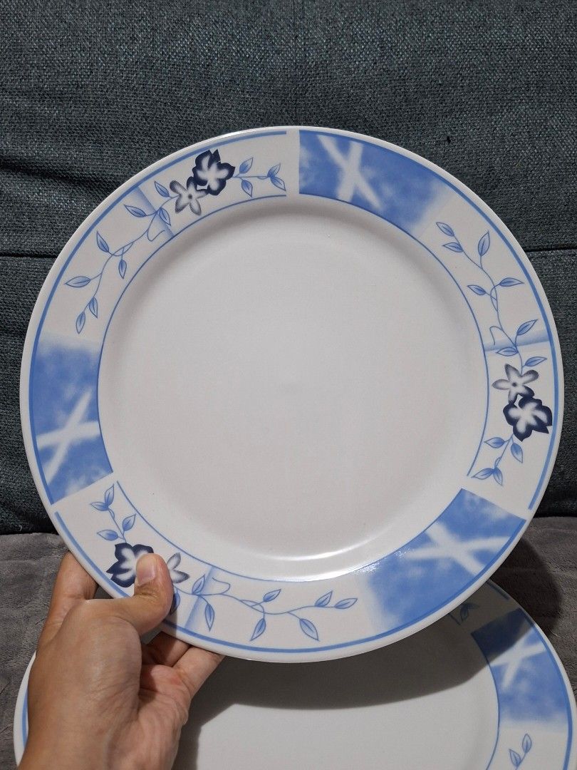 Blue Floral Ceramic Dinnerware Set with Cups (Category: Dinnerware & Cutlery) located in Taguig. Submitted by thrift_outlet.taguig (Listing ID 1460480017, Image 2). Description: 4 pcs. Blue Flower Design Plates 10.5" and 4 pcs. Mugs 2.2" - NEVER used - Set of ceramic plates and cups - Features a charming blue floral design with a watercolor-like pattern - Perfect for guests or daily use - Dishwasher safe - No chips or cracks.