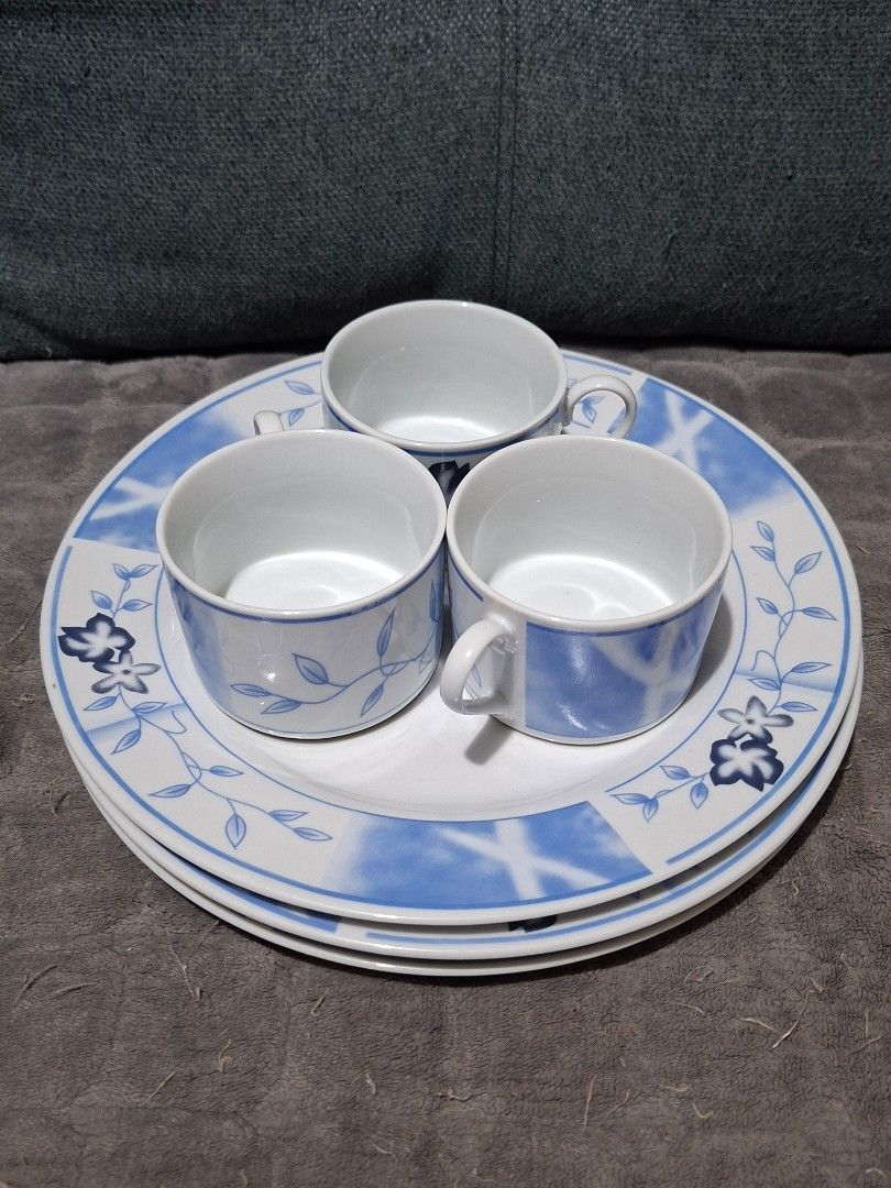 Blue Floral Ceramic Dinnerware Set with Cups (Category: Dinnerware & Cutlery) located in Taguig. Submitted by thrift_outlet.taguig (Listing ID 1460480017, Image 1). Description: 4 pcs. Blue Flower Design Plates 10.5" and 4 pcs. Mugs 2.2" - NEVER used - Set of ceramic plates and cups - Features a charming blue floral design with a watercolor-like pattern - Perfect for guests or daily use - Dishwasher safe - No chips or cracks.