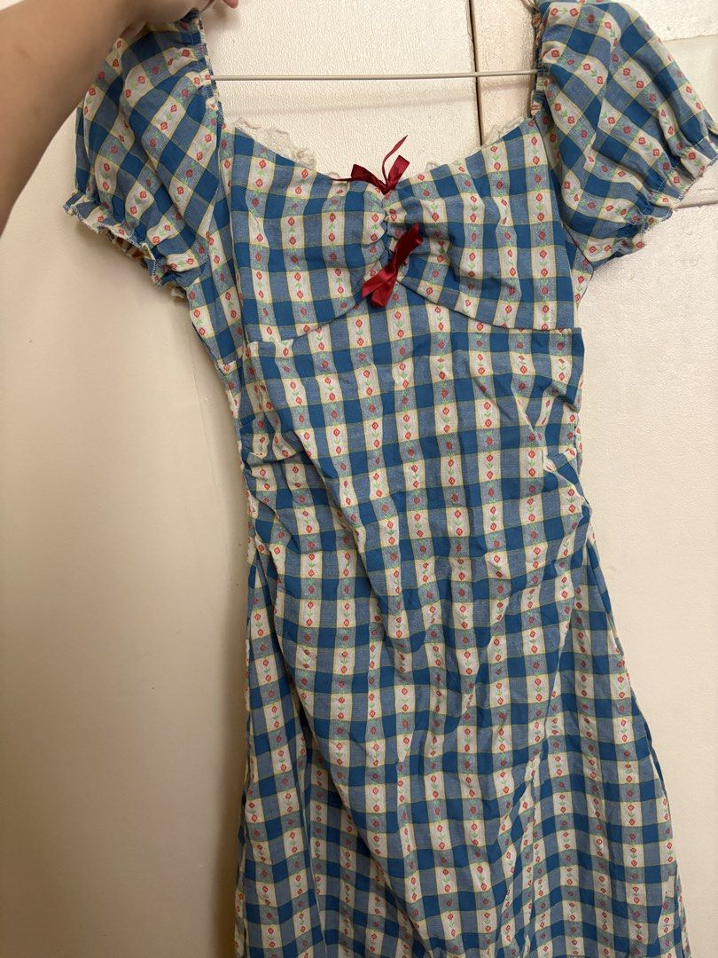Blue Gingham Puff Sleeve Dress with Red Bow (Category: Dresses) located in Manila. Submitted by z.finds (Listing ID 1460371822, Image 1). Description: - Adorable blue gingham dress - Sweetheart neckline - Puff sleeves with a small red bow detail - Shirring on the sides for a flattering, adjustable fit - Zipper closure at the back - Perfect for picnics, casual outings, or a cute day out.