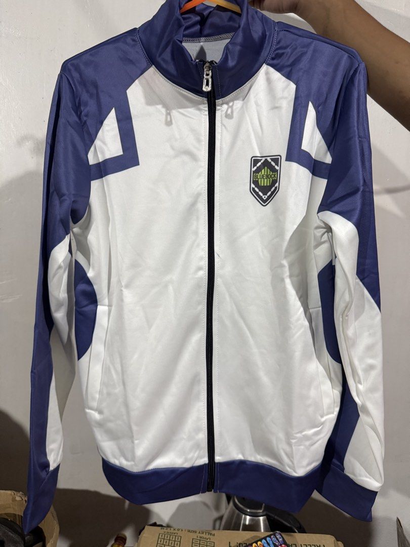 Blue Lock Karasu 6 Anime Track Jacket (Category: Coats, Jackets and Outerwear) located in Caloocan City. Submitted by Appareildemusique (Listing ID 1460449278, Image 1). Description: - Original Price 800+ - unused (brand new) - Official Blue Lock anime track jacket - Features Karasu and the number 6 on the back - Stylish white and blue design - Blue Lock crest prominently displayed on the front - Full zip closure for easy wear - Ideal for any Blu