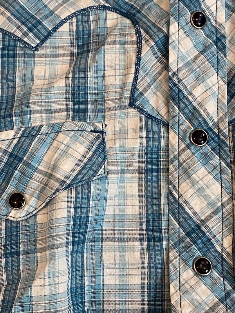 Blue Plaid Western Style Button-Up Shirt - Medium (Category: Tshirts & Polo Shirts ) located in Manila. Submitted by sebthrift (Listing ID 1460358520, Image 3). Description: - Classic blue and white plaid long-sleeve shirt - Western style with snap buttons - Two chest pockets - Brand: BRETT - Size: MEDIUM - Ideal for casual wear.
