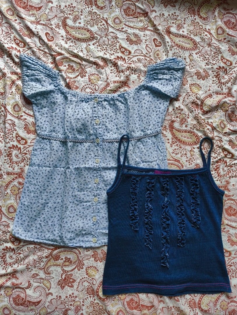 XS to S Blue Tops Bundle (Category: Blouses) located in Pasig City. Submitted by gaosorio17 (Listing ID 1460395968, Image 1). Description: - Both tops are thrifted but they don't fit me well - Both fit XS to S - No when worn for these Top 1: - Floral light blue milkmaid style top - Garterized puff sleeves - Working and complete buttons - Can be worn as an off shoulder top Top 2: - Denim-like sleeveless top - With ruffle detail and purple contrast