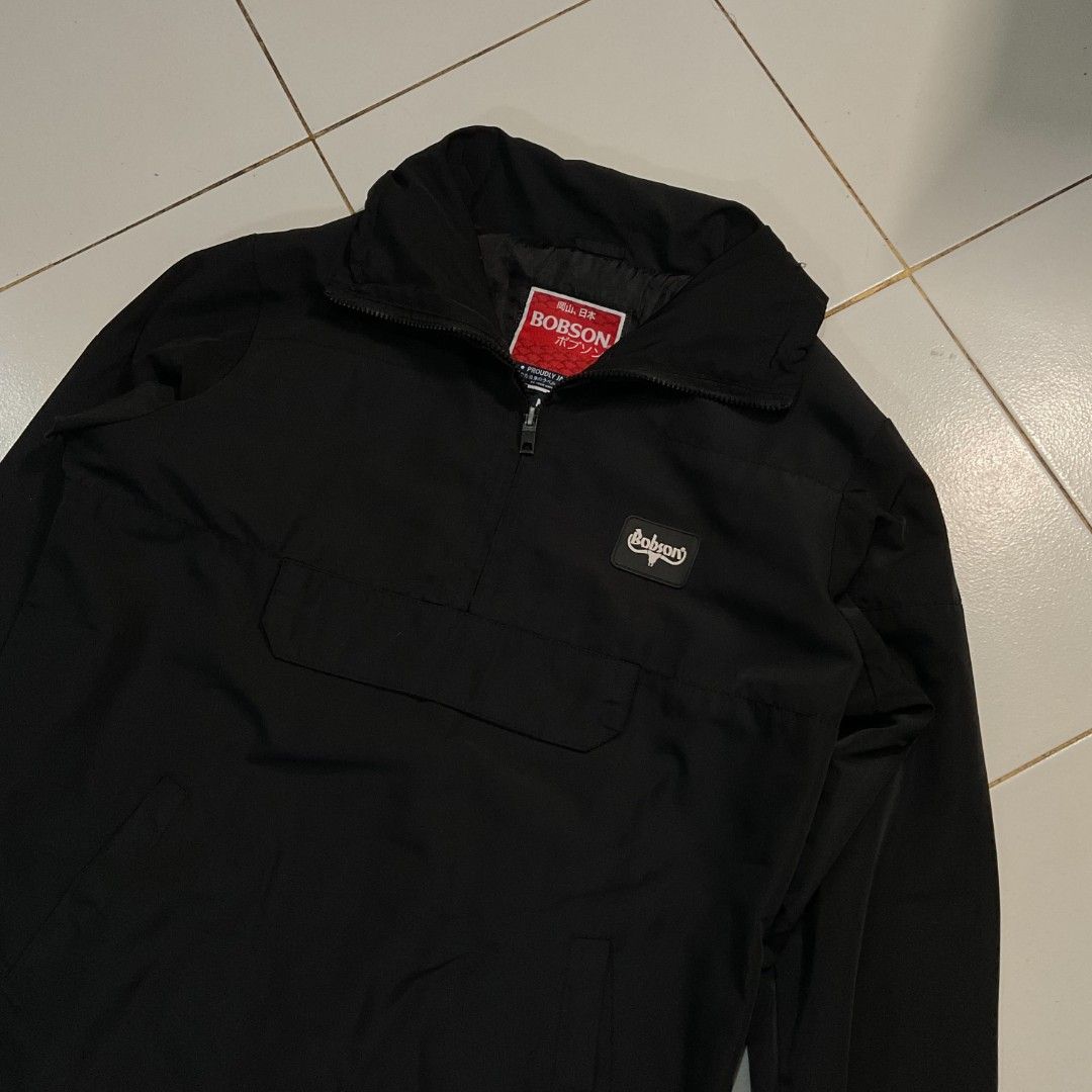 Bobson Black Anorak Jacket (Category: Coats, Jackets and Outerwear) located in Morong. Submitted by rusty.vault (Listing ID 1460416095, Image 2). Description: - Black Bobson anorak jacket - Quarter zip closure - Large front pocket - Adjustable drawstring hem - Versatile collar: zip up or fold down - Perfect for layering - Simple and classic design.