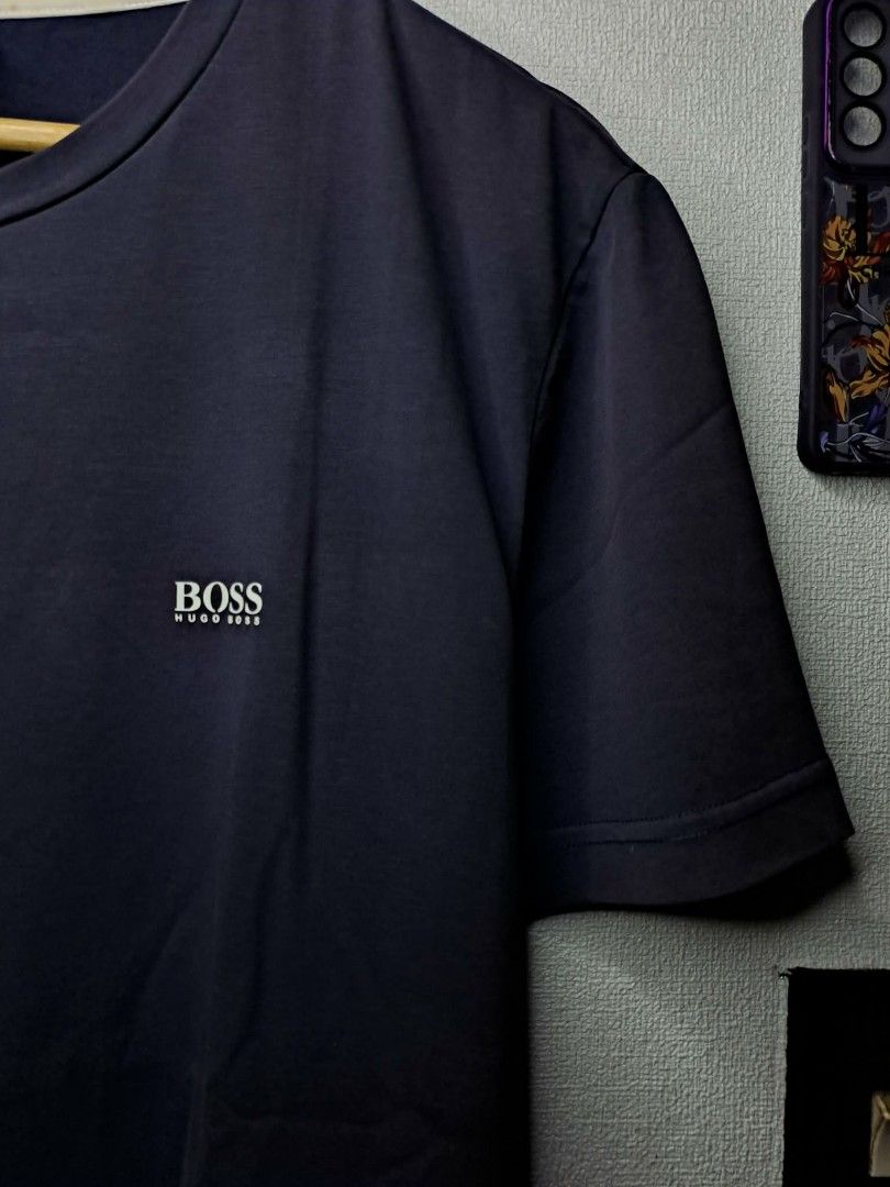 Boss Hugo Boss T - Shirt 2 - Pack (Category: Tshirts & Polo Shirts ) located in Quezon City. Submitted by yaseen73 (Listing ID 1460312523, Image 2). Description: Boss By Hugo Boss Navy Blue Embossed Logo Spandex Cotton Wearing Size : Large Pit to Pit Width 22 Lenght 28 Color Rate 9/10 Good Condition 500 Shipped Via J&T Express Around Metro Manila Seller's Location: 📍Brgy. Pansol, Q.C.