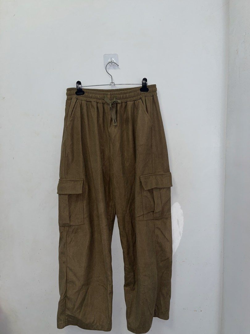 Brown Corduroy Cargo Pants (Medium to Large) (Category: Other Bottoms) located in Binmaley. Submitted by thegirlscloset1 (Listing ID 1460459663, Image 1). Description: - Brown corduroy pants - Elastic waistband with drawstring - Two side pockets - Two cargo pockets on legs - Relaxed fit - Perfect for casual wear.