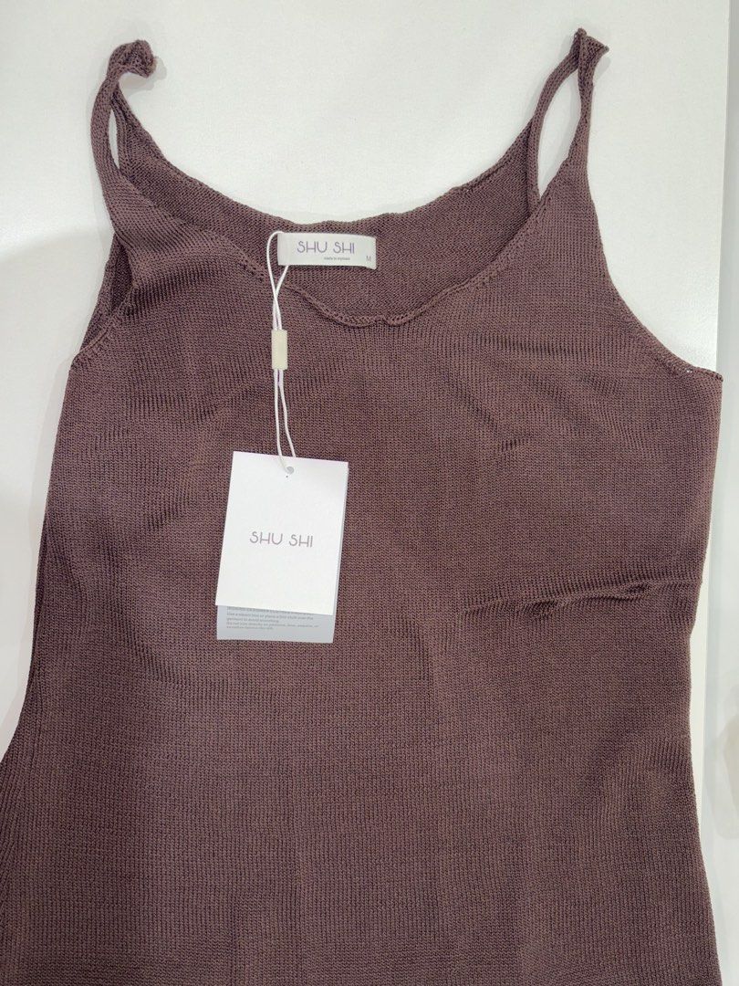 Brown Knitted V-Neck Camisole Top (Category: Sleeveless) located in Quezon City. Submitted by izasalvadorr.1 (Listing ID 1460062037, Image 2). Description: - Brown knitted camisole top - V-neckline with thin straps - Ribbed texture throughout - Versatile: pairs well with denim, easy to dress up or down - Comfortable and stylish for everyday wear Bought the wrong size for me, comes in original box and tag.