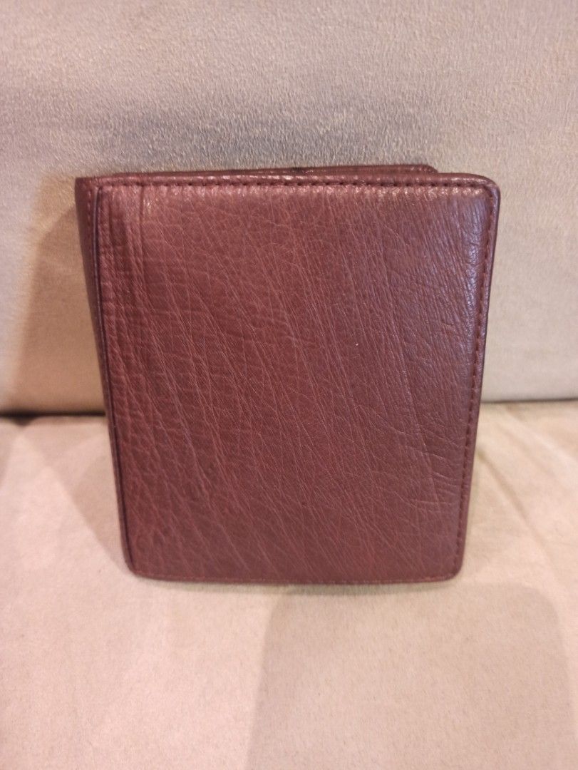 Brown Ostrich Leather Bifold Wallet (Category: Wallets & Card holders) located in Caloocan City. Submitted by rtarellano (Listing ID 1460438405, Image 2). Description: - Brown (strich leather bifold wallet - Multiple card slots inside - Secure snap closure - Ideal size for daily use.