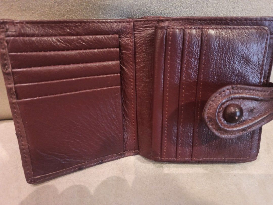 Brown Ostrich Leather Bifold Wallet (Category: Wallets & Card holders) located in Caloocan City. Submitted by rtarellano (Listing ID 1460438405, Image 3). Description: - Brown (strich leather bifold wallet - Multiple card slots inside - Secure snap closure - Ideal size for daily use.