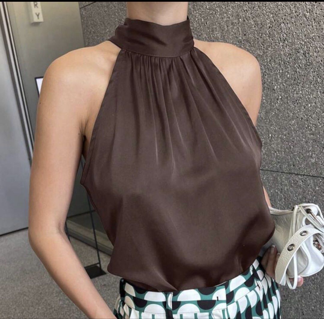 Brown Satin Halter Neck Top (Category: Sleeveless) located in Iloilo. Submitted by dabyladaby2 (Listing ID 1460395938, Image 1). Description: - Rich brown satin halter neck top - Gathered neckline with a high collar - Sleeveless design - Versatile for night outs or chic daytime looks - Comfortable and stylish - bust 36.2 , length 21.1 in.