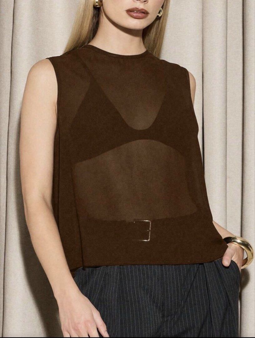 Brown Sleeveless Sheer Mesh Top (Category: Sleeveless) located in Iloilo. Submitted by dabyladaby2 (Listing ID 1460329682, Image 1). Description: - Sheer brown sleeveless top - Lightweight fabric with subtle texture - Relaxed and flowy cut - Ideal for layering over bralettes or camisoles ( not included) - Versatile for dressing up or down - shoulder 14.4 in , bust 38.6 in , length - 20.7 in .